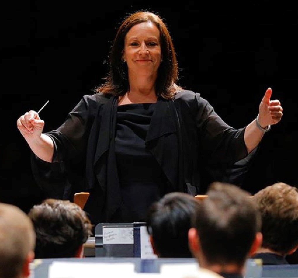 Dr. Samuels conducting in front of a youth orchestra.